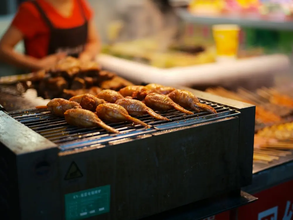 Skewers grilling at a street stall