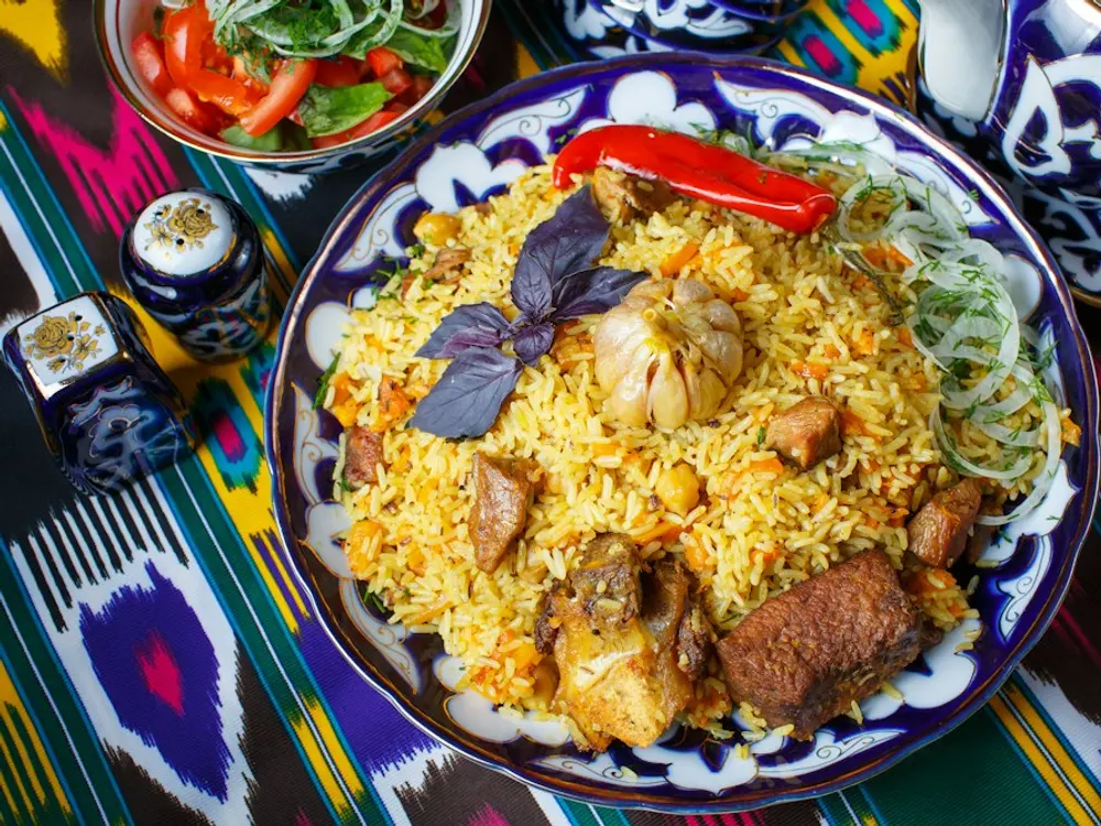Pulao with tender meat on a patterned plate