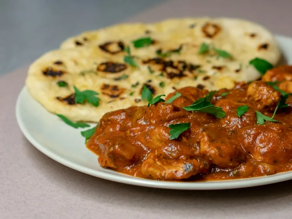 Rich curry served with naan